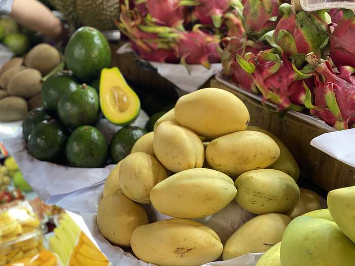 Avocadoes, mangoes, and papayas for sale
